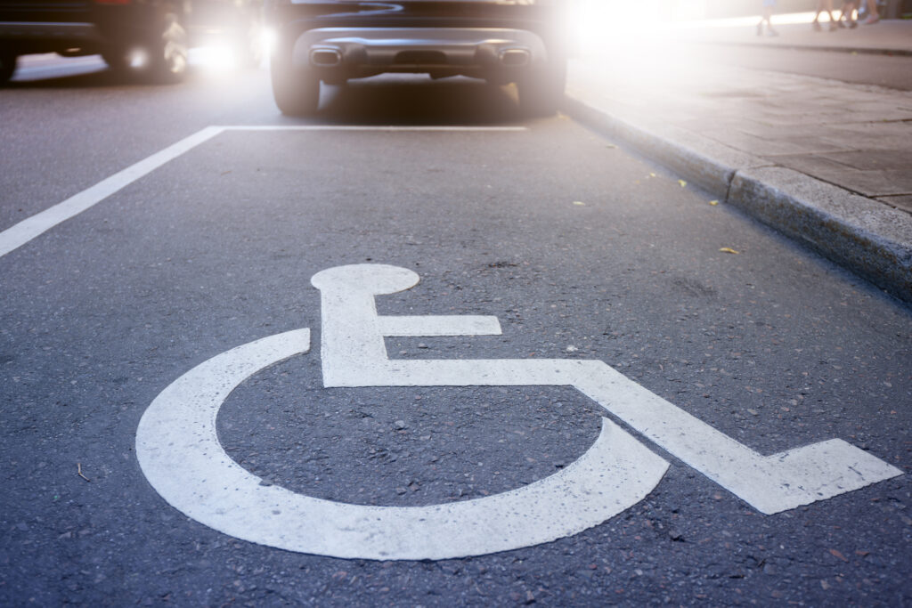 handicap sign painted on the road